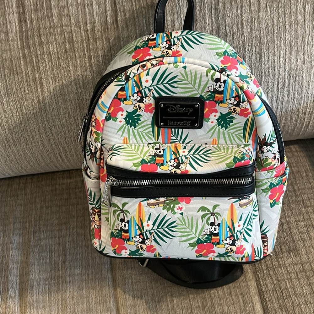 Disney’s making a mini tropical surfboard lounge fly backpack 10 1/2 x 9